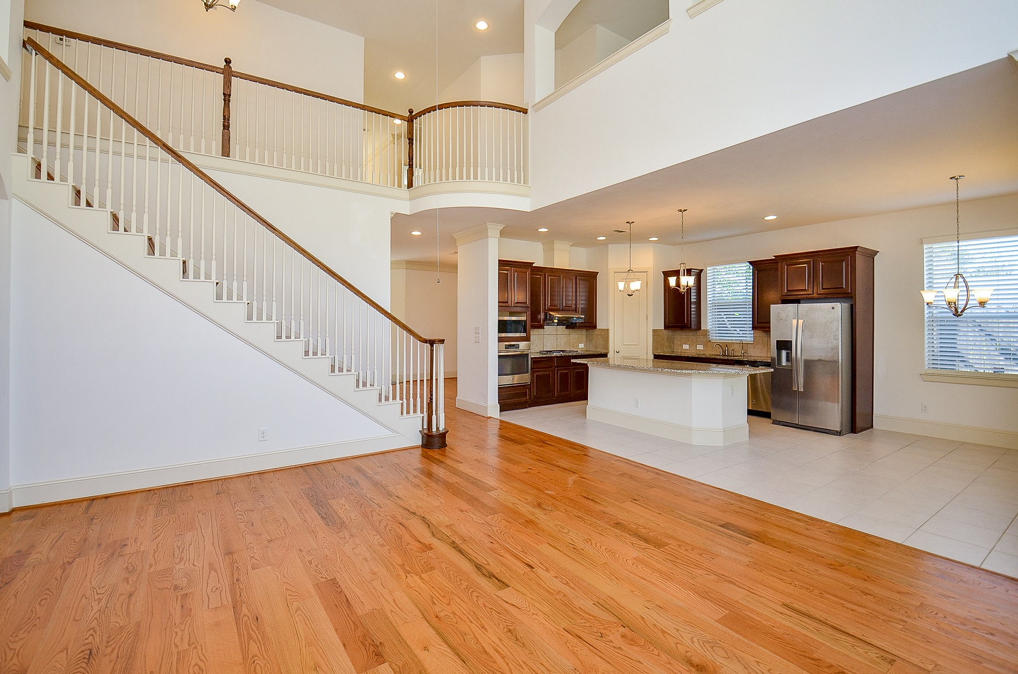 3302 Rochdale Street Houston, TX 77025 - Photo 25 of 49 a view of a hallway with wooden floor and staircase