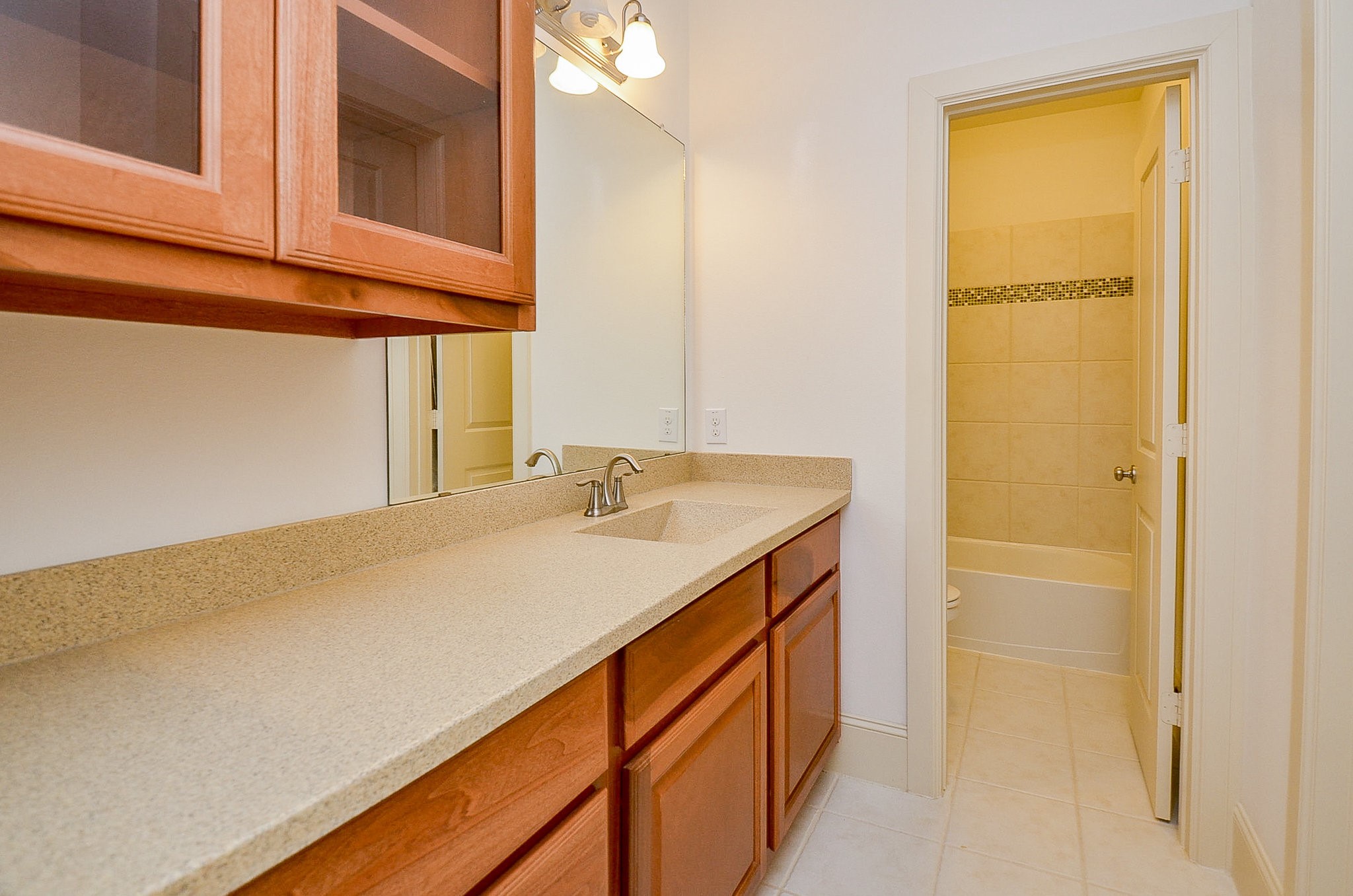 3302 Rochdale Street Houston, TX 77025 - Photo 40 of 49 a bathroom with a sink and a mirror