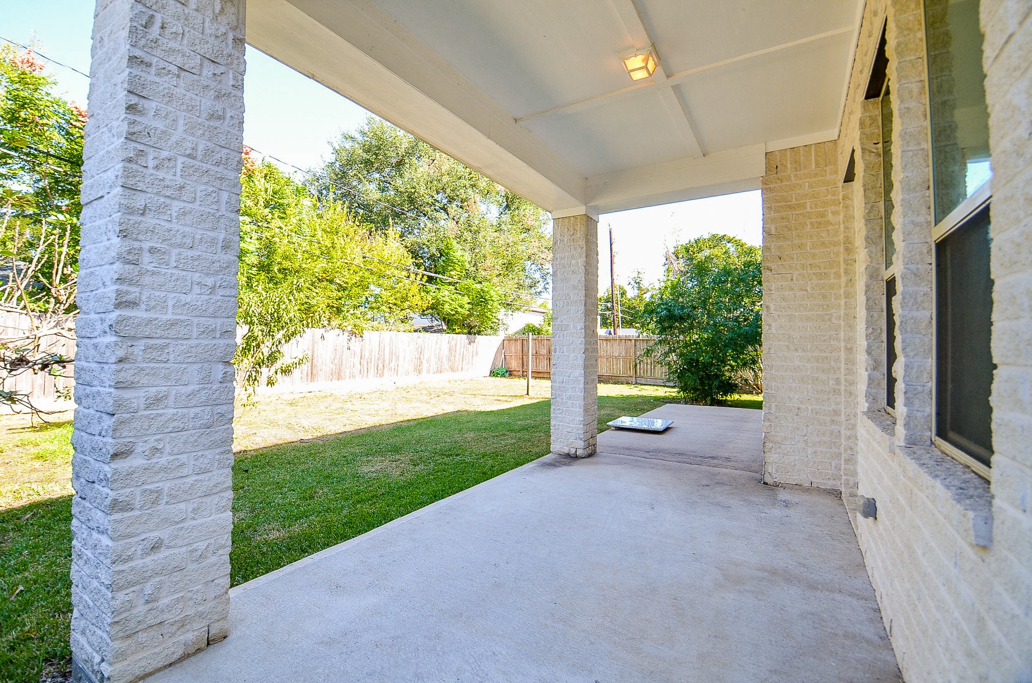 3302 Rochdale Street Houston, TX 77025 - Photo 41 of 49 a view of a porch with chairs and a yard