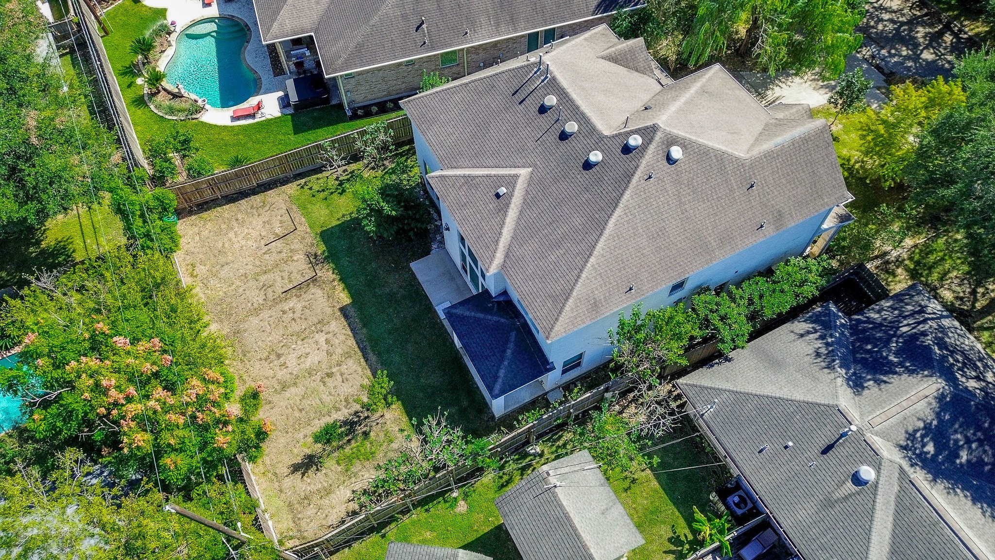 3302 Rochdale Street Houston, TX 77025 - Photo 46 of 49 an aerial view of a house with a yard and large trees