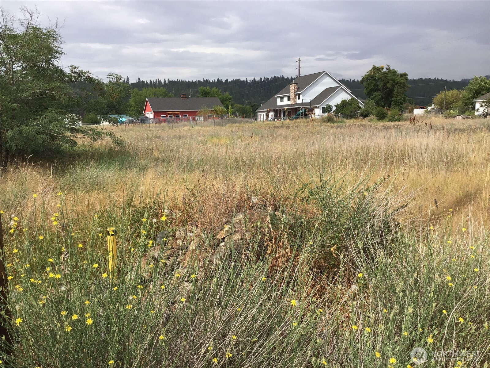 13007 East Wellesley Avenue Spokane Valley, WA 99216 - Photo 1 of 5 a view of a town with mountains in the background