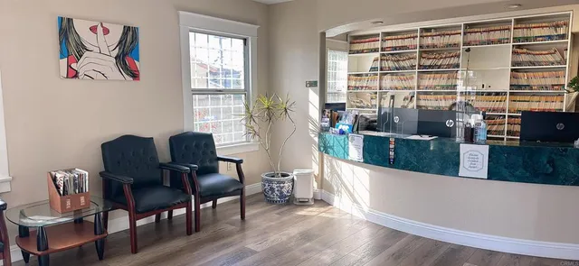 a view of a dining room with furniture and window