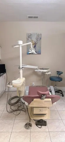 a view of a workspace with a table and chair