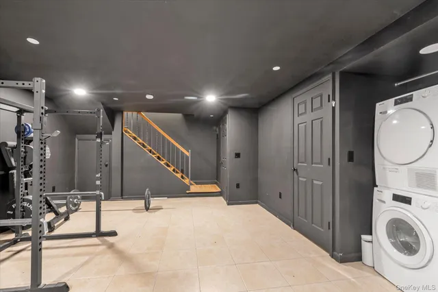 a view of a hallway with entryway washer and dryer