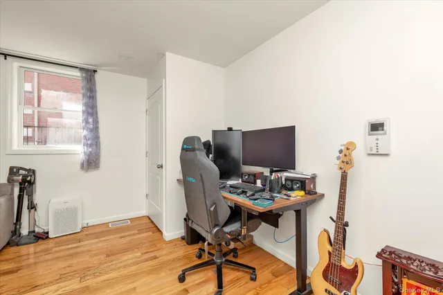 a workspace with furniture and wooden floor