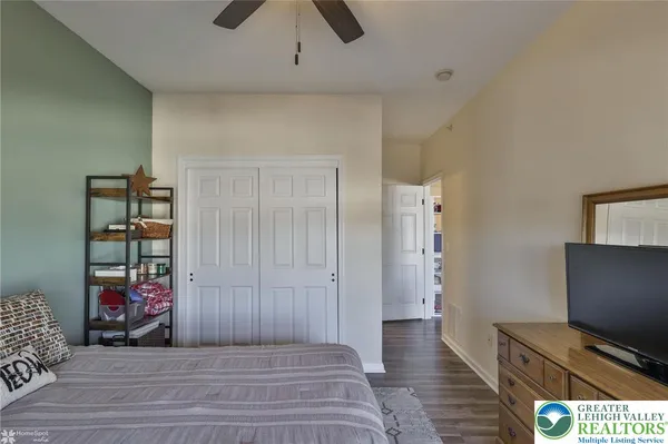 an aerial view of residential houses with outdoor space and lake view