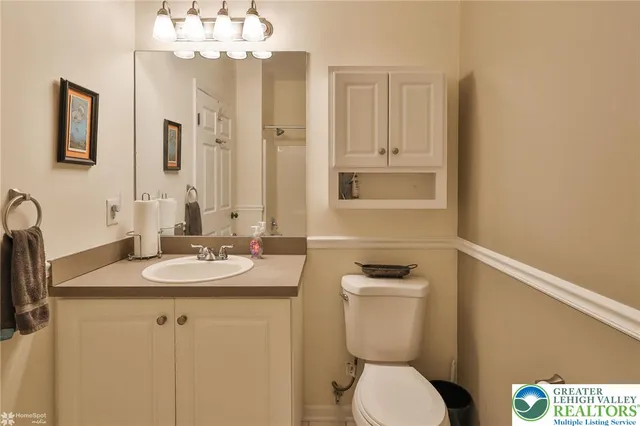 a living room with furniture and large windows