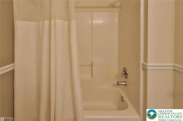 a living room with furniture dining table and a large window