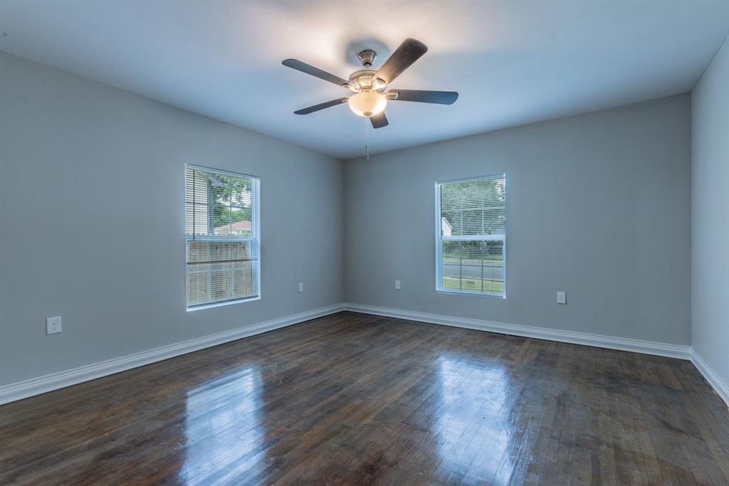 2816 Summer Avenue Waco, TX 76708 - Photo 7 of 16 a view of an empty room with wooden floor and a window
