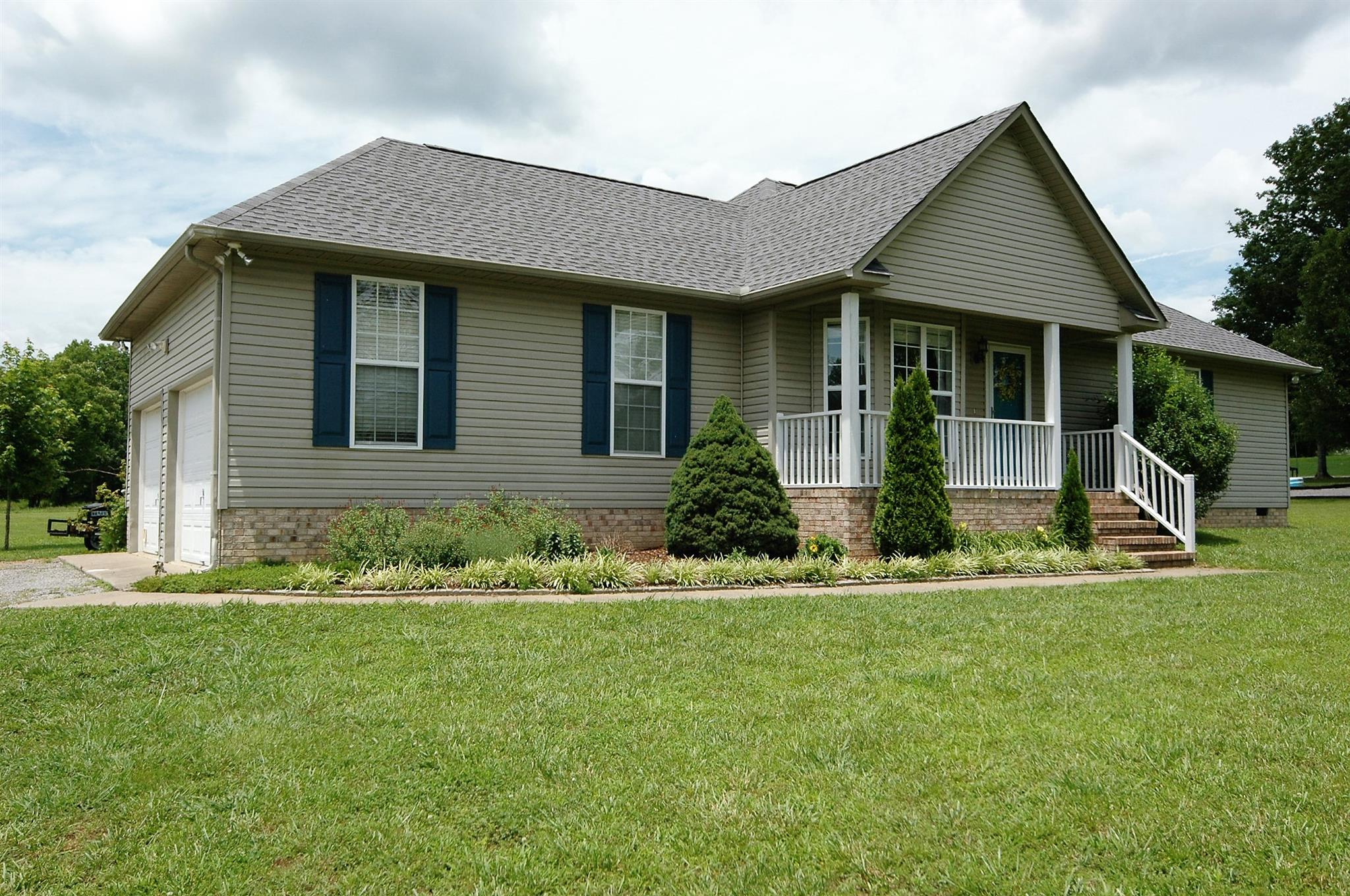 1961 Lasea Road Spring Hill, TN 37174 - Photo 1 of 18 a front view of a house with a yard