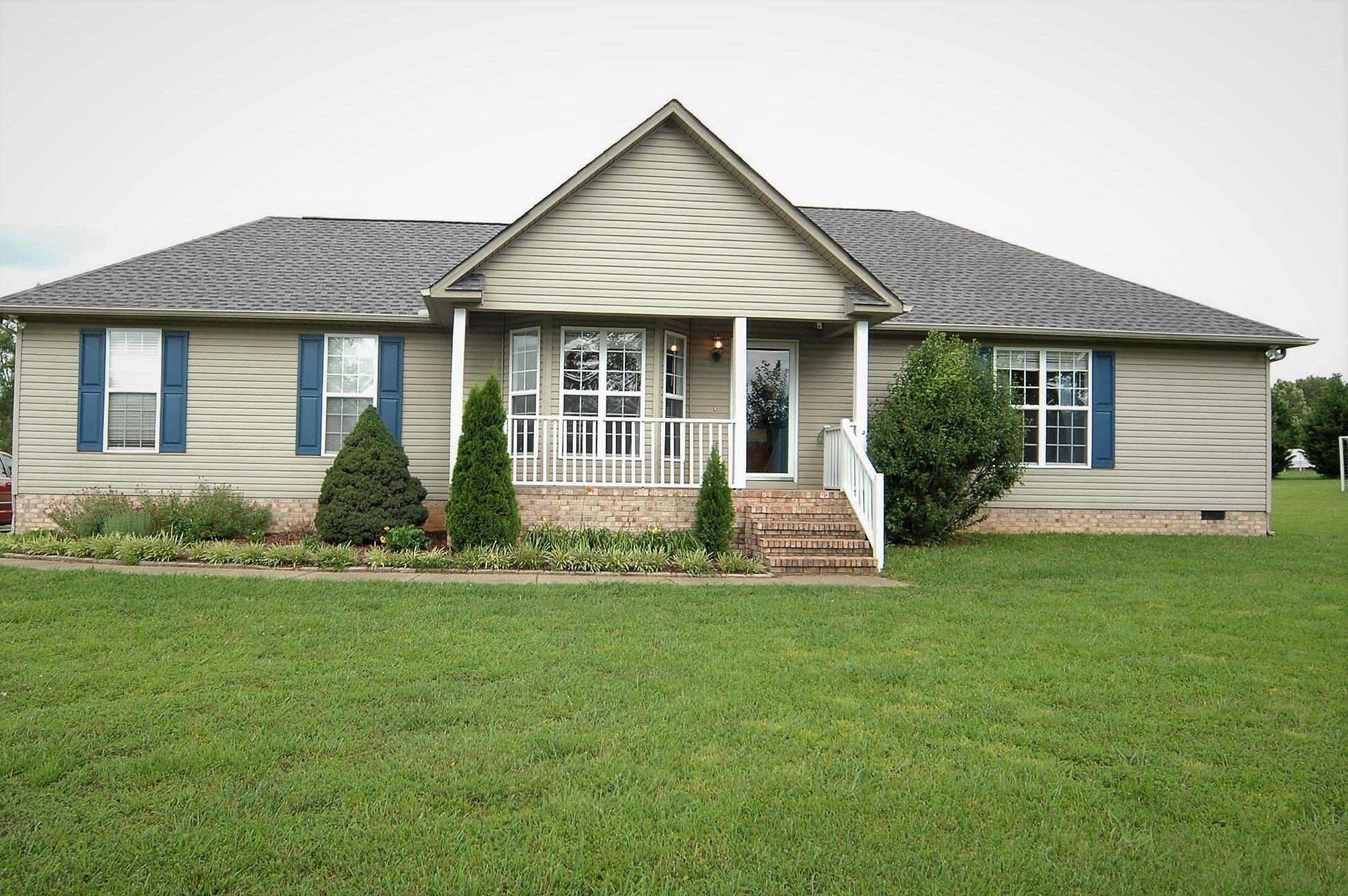 1961 Lasea Road Spring Hill, TN 37174 - Photo 2 of 18 a front view of a house with a yard