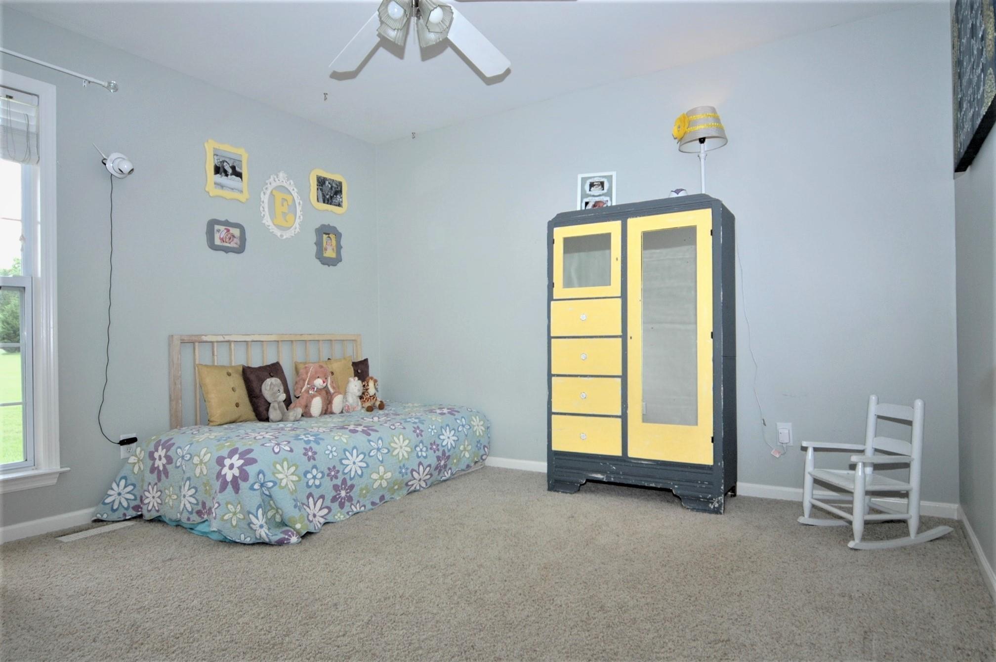 1961 Lasea Road Spring Hill, TN 37174 - Photo 14 of 18 a room with toys and a window
