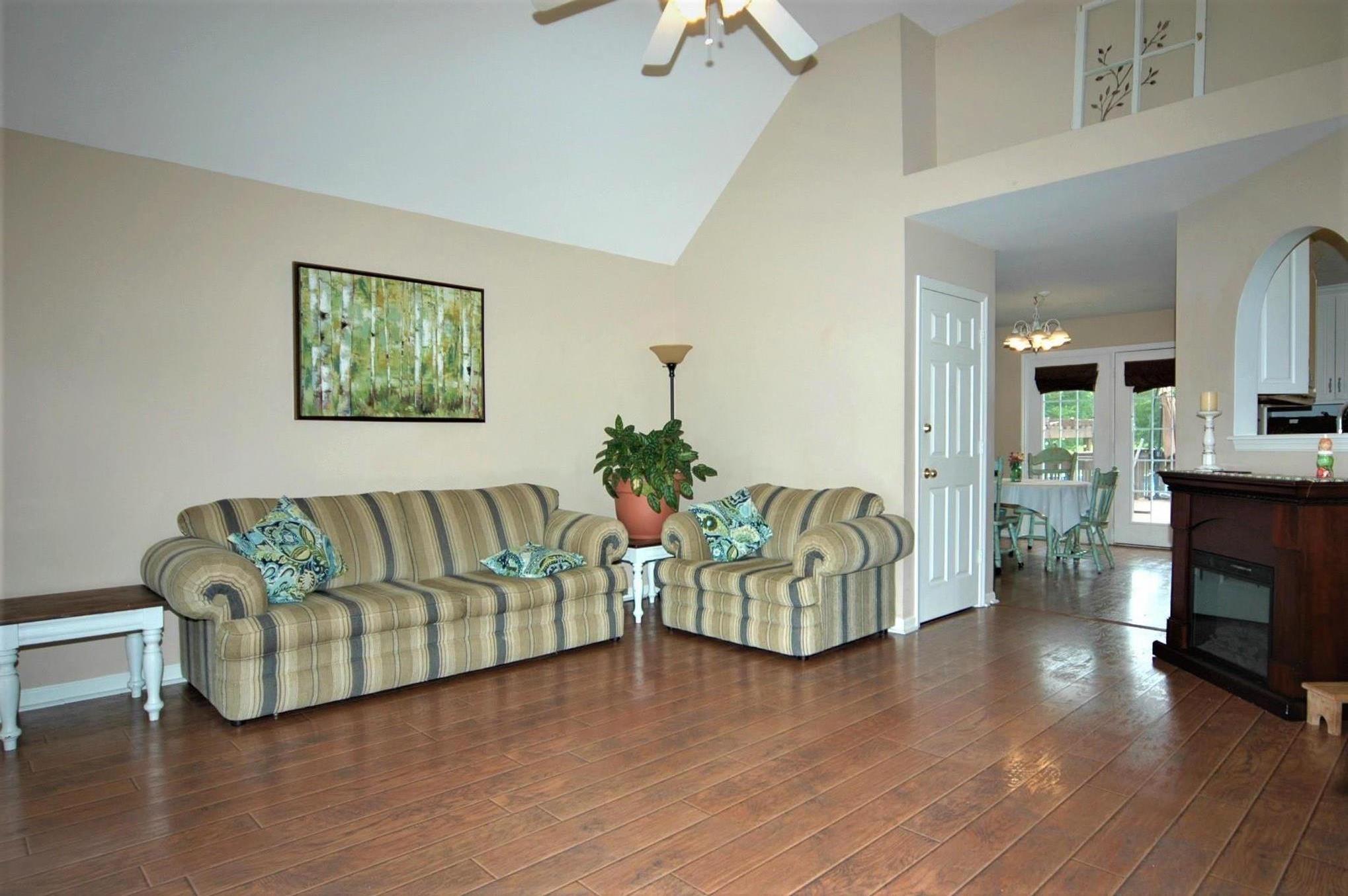 1961 Lasea Road Spring Hill, TN 37174 - Photo 15 of 18 a living room with fireplace furniture and a wooden floor