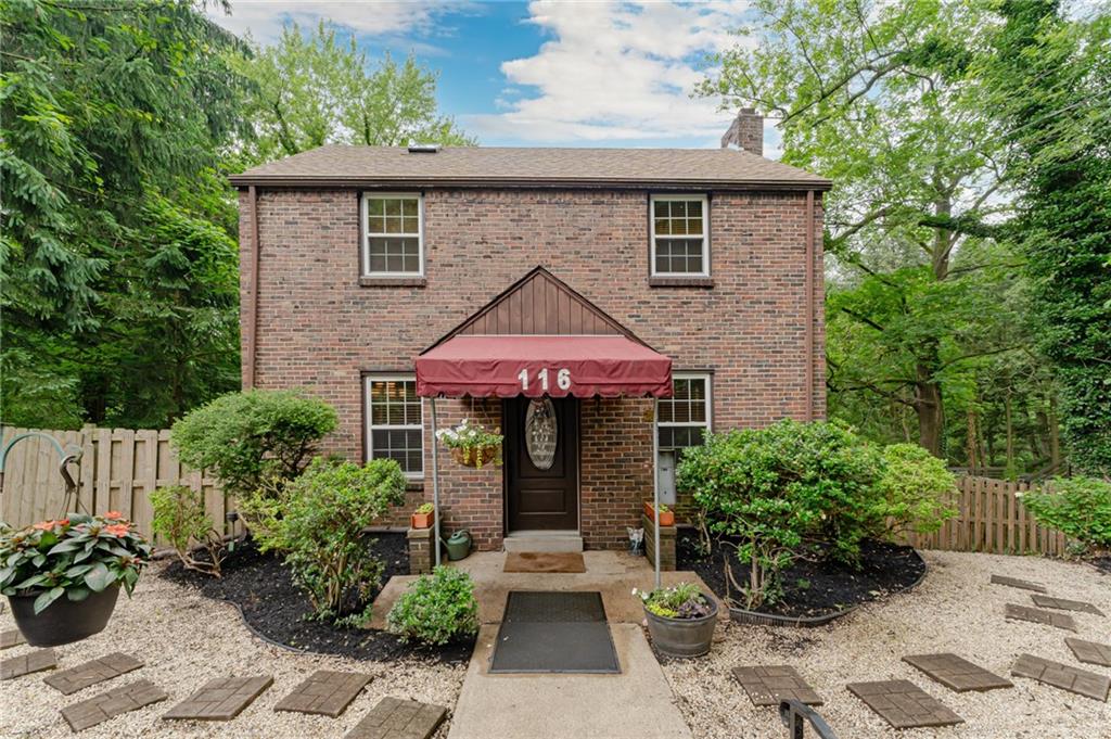 116 Elmore Road Pittsburgh, PA 15221 - Photo 2 of 16 a front view of a house with a garden