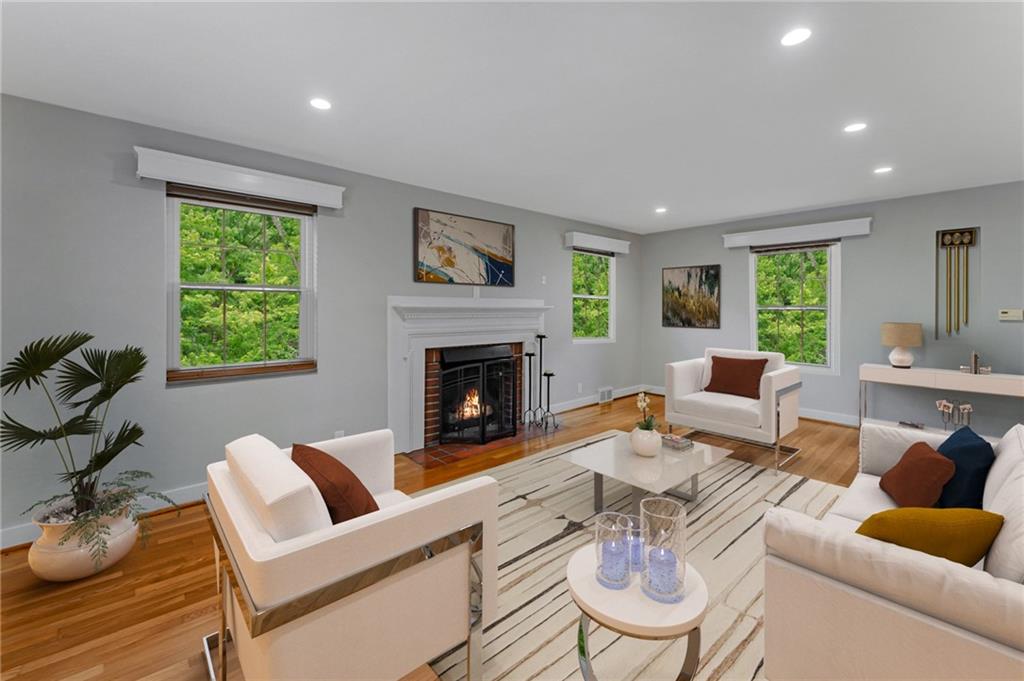 116 Elmore Road Pittsburgh, PA 15221 - Photo 4 of 16 a living room with furniture a fireplace and a window