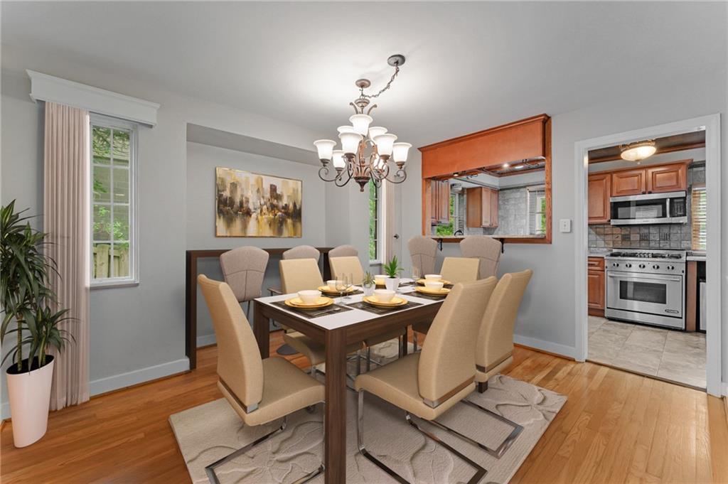 116 Elmore Road Pittsburgh, PA 15221 - Photo 5 of 16 a view of a dining room with furniture and wooden floor