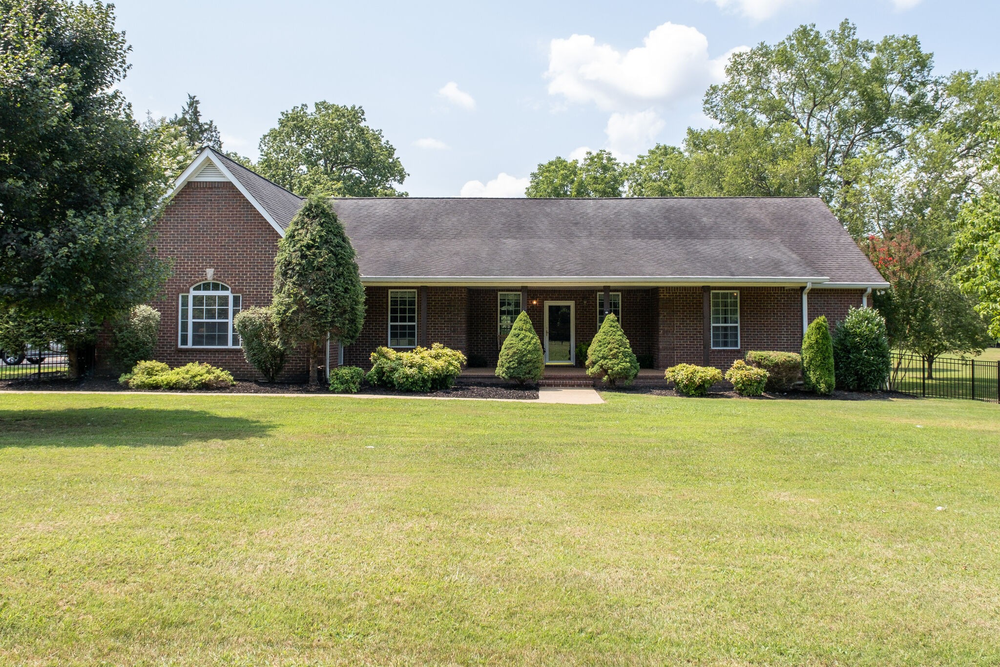 278 Vesta Road Lebanon, TN 37090 - Photo 1 of 44 a front view of a house with a yard and trees