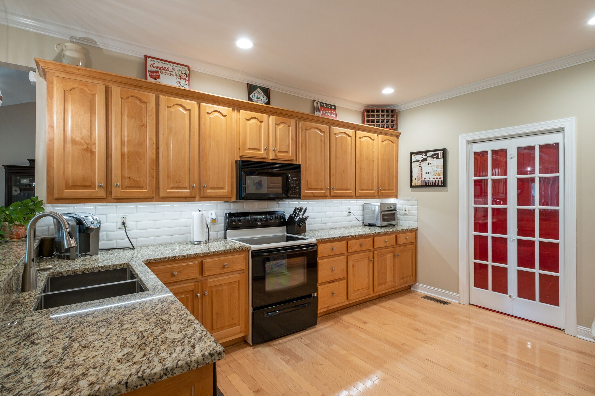 278 Vesta Road Lebanon, TN 37090 - Photo 14 of 44 a kitchen with stainless steel appliances granite countertop a stove a sink and a microwave