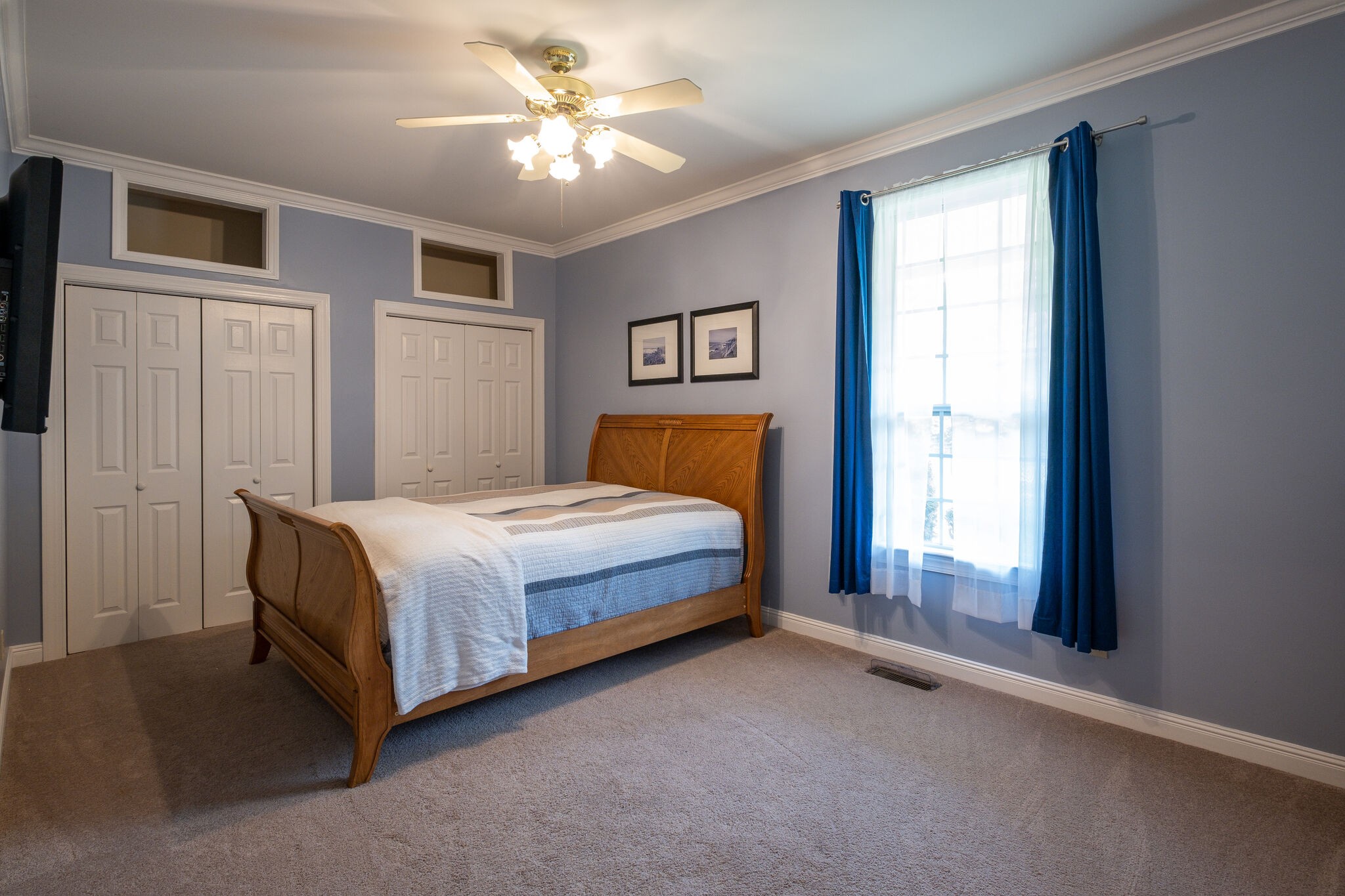 278 Vesta Road Lebanon, TN 37090 - Photo 22 of 44 a bedroom with a large bed and a chandelier