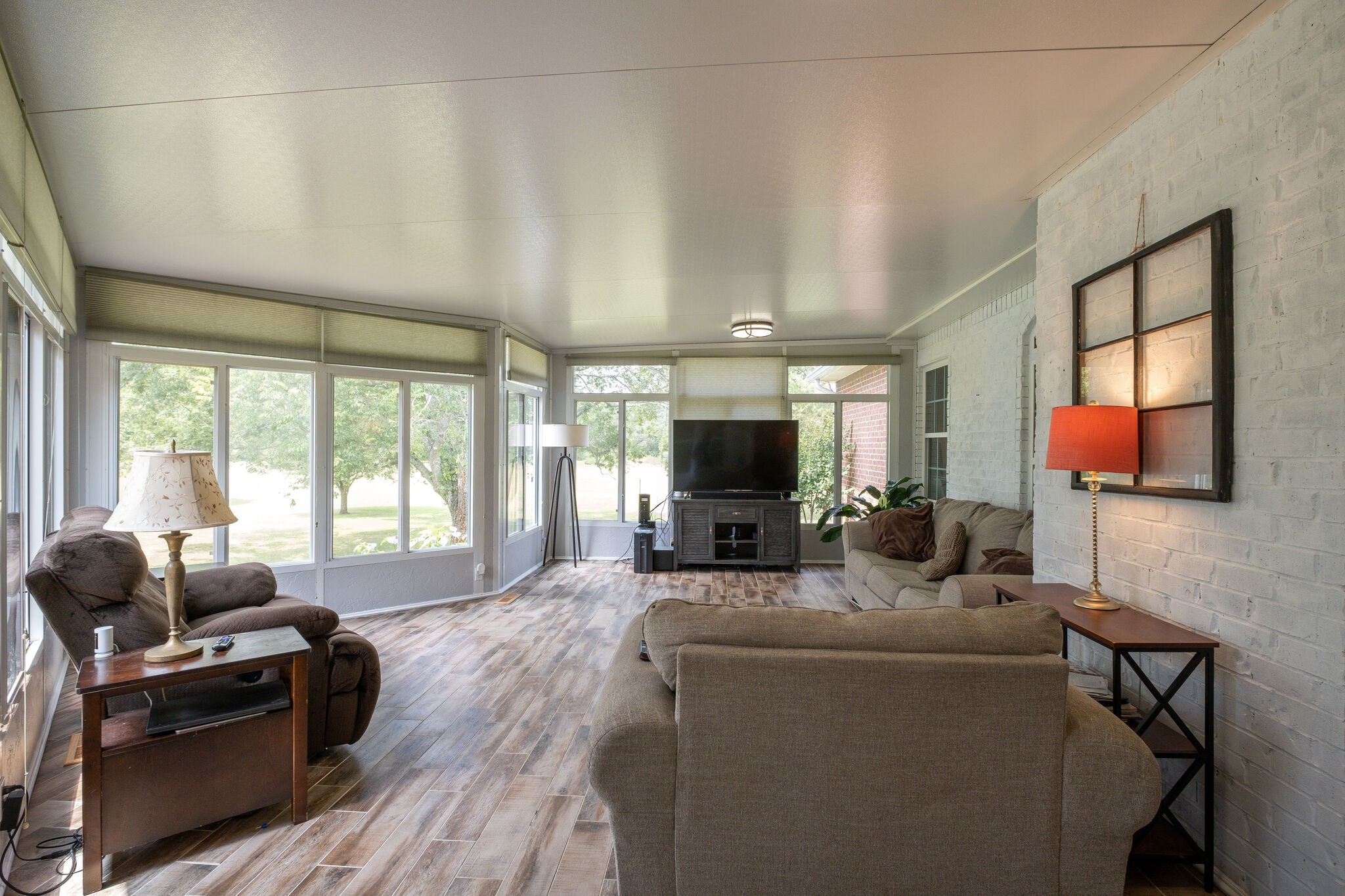 278 Vesta Road Lebanon, TN 37090 - Photo 29 of 44 a living room with furniture a flat screen tv and a large window