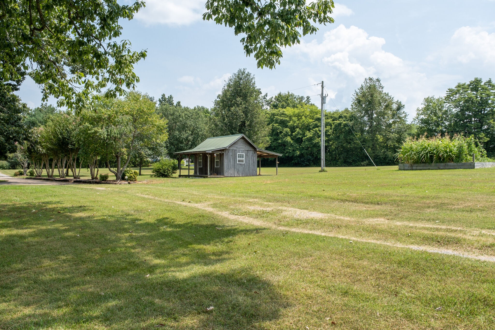 278 Vesta Road Lebanon, TN 37090 - Photo 40 of 44 a view of an house with backyard space and trees