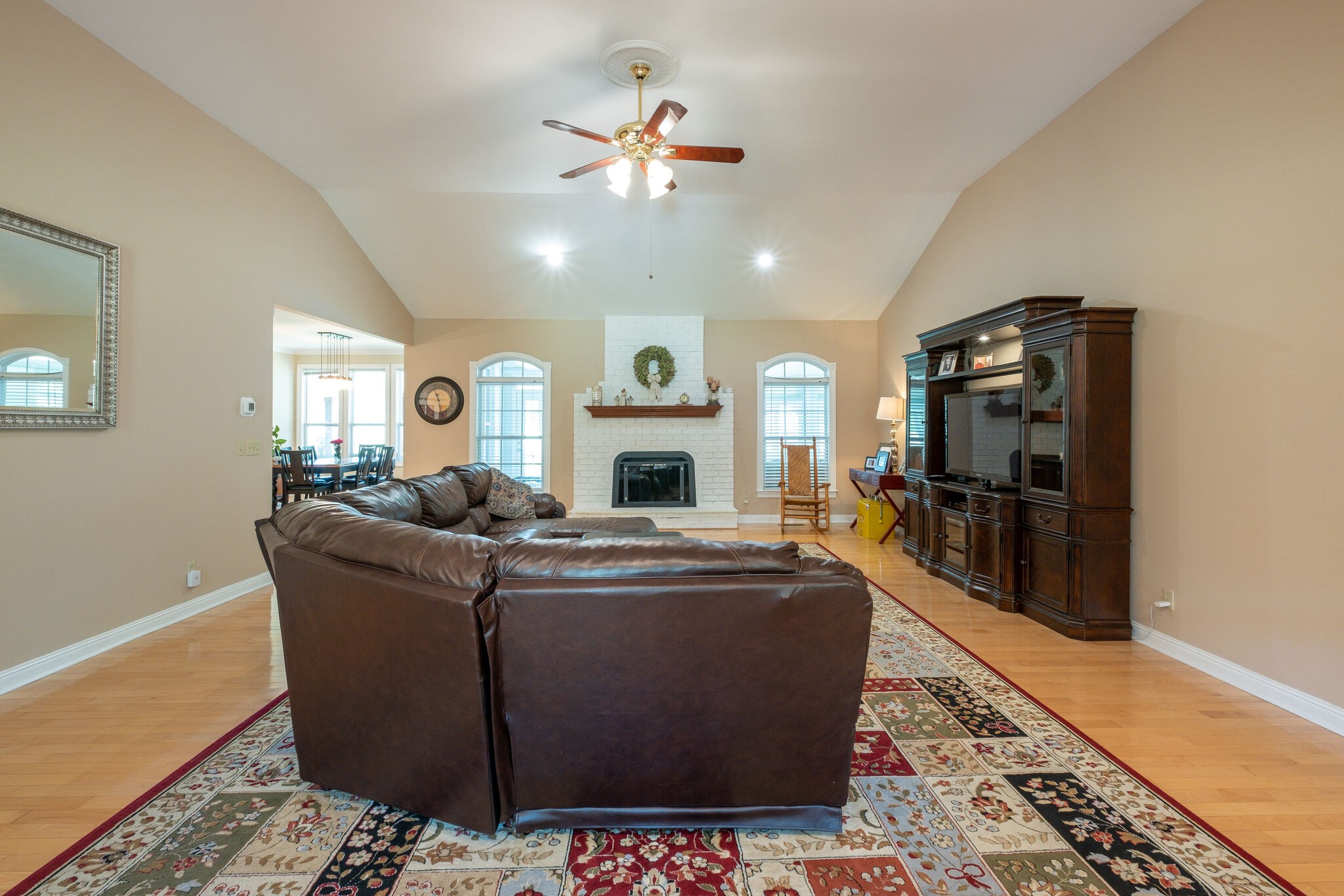 278 Vesta Road Lebanon, TN 37090 - Photo 8 of 44 a living room with furniture a fireplace and a chandelier
