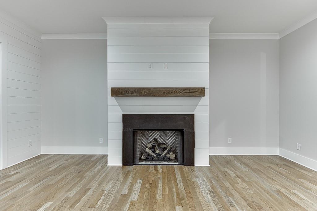 7620 Breeze Bay Road Cumming, GA 30041 - Photo 14 of 53 a living room with a fireplace and a fireplace