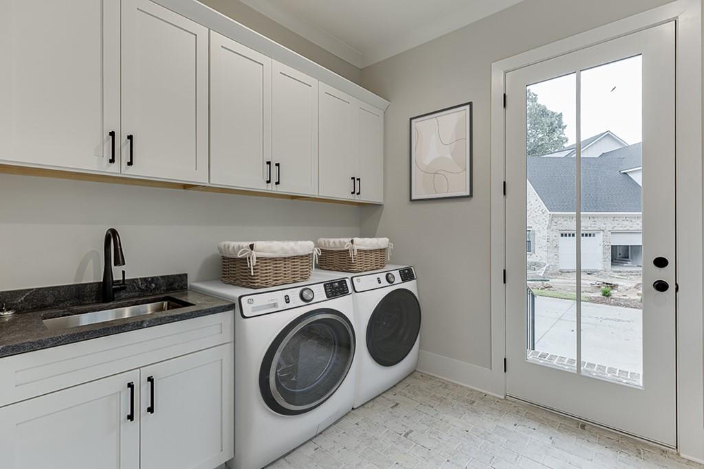 7620 Breeze Bay Road Cumming, GA 30041 - Photo 22 of 53 a view of a kitchen with washer and dryer