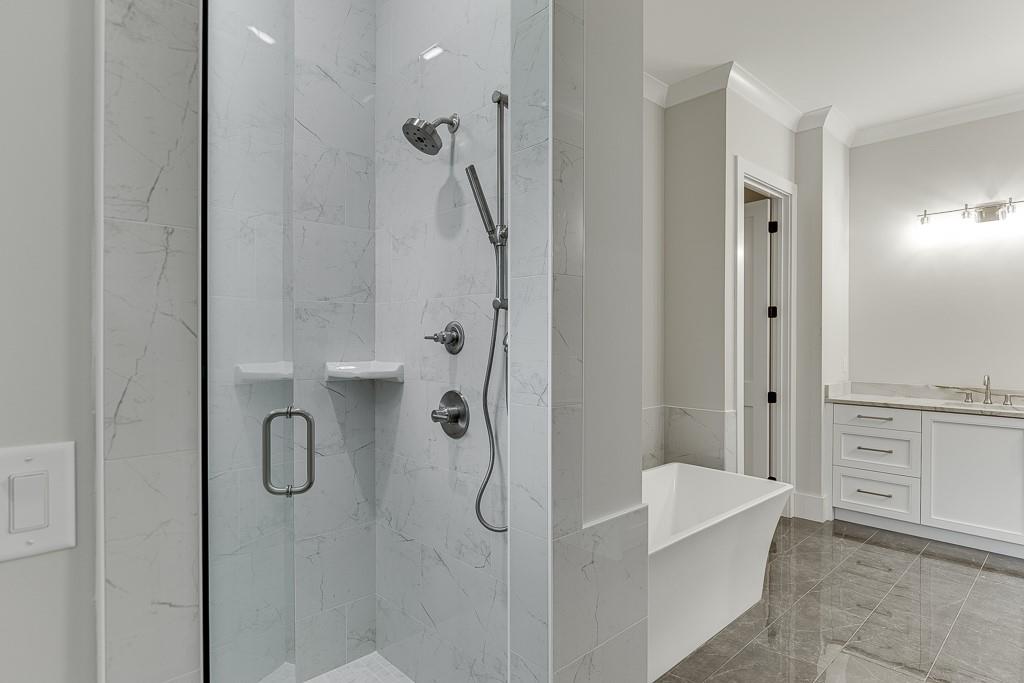 7620 Breeze Bay Road Cumming, GA 30041 - Photo 27 of 53 a bathroom with a granite countertop shower mirror and a sink