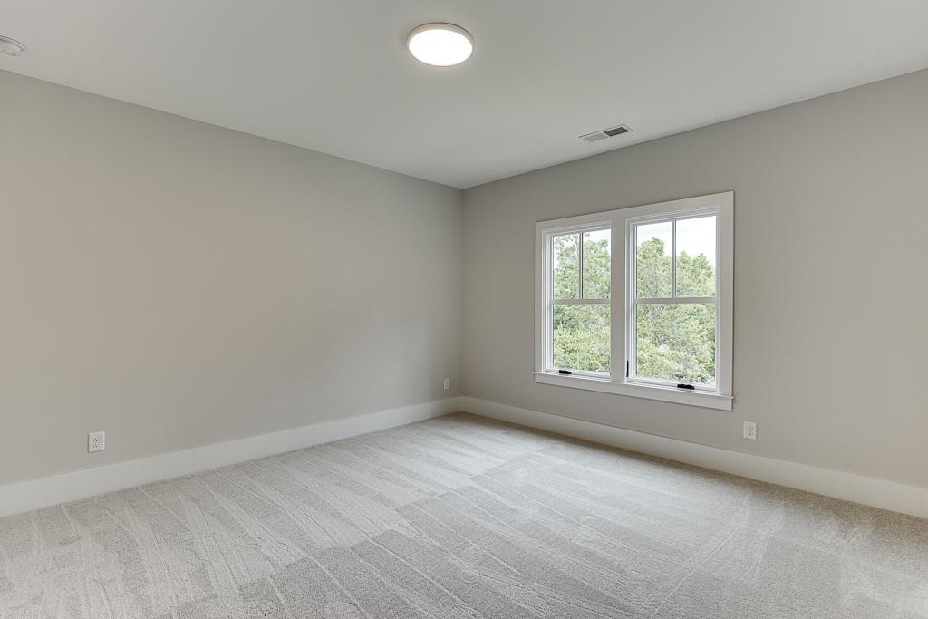 7620 Breeze Bay Road Cumming, GA 30041 - Photo 30 of 53 an empty room with a window