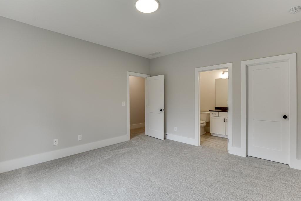 7620 Breeze Bay Road Cumming, GA 30041 - Photo 32 of 53 a view of an empty room and a room