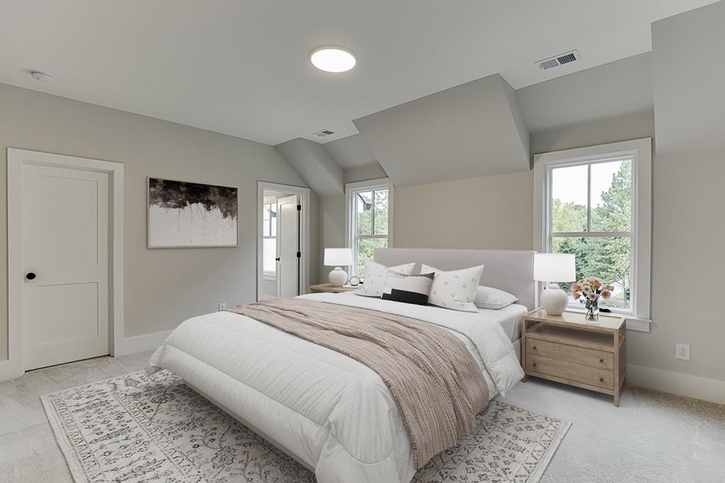 7620 Breeze Bay Road Cumming, GA 30041 - Photo 36 of 53 a bedroom with a bed a couch and a window