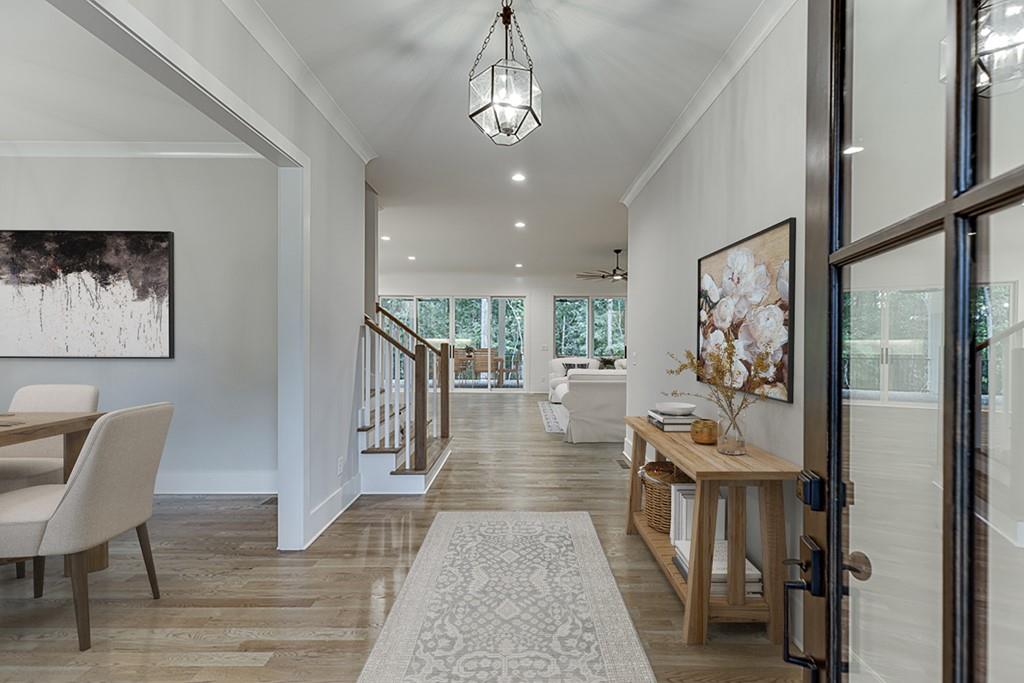 7620 Breeze Bay Road Cumming, GA 30041 - Photo 4 of 53 a view of a hallway with wooden floor and windows