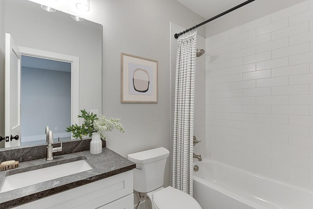 7620 Breeze Bay Road Cumming, GA 30041 - Photo 41 of 53 a bathroom with a sink toilet and shower