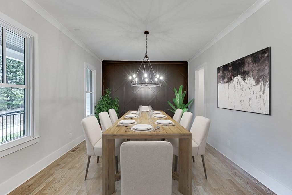 7620 Breeze Bay Road Cumming, GA 30041 - Photo 6 of 53 a view of a dining room with furniture window and wooden floor