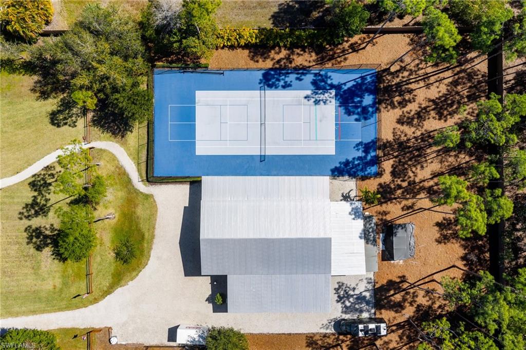6610 Sable Ridge Lane Naples, FL 34109 - Photo 39 of 47 Tennis court, covered pickleball