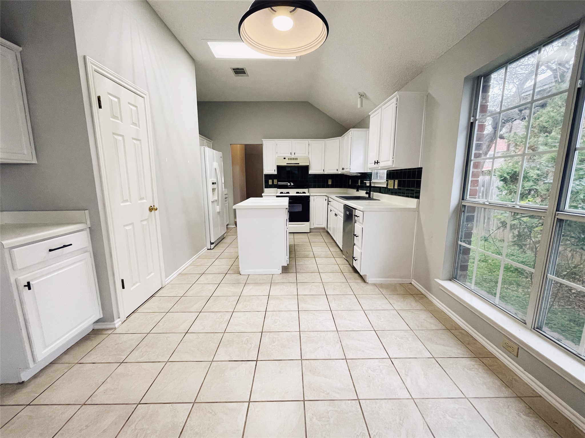 204 Cripple Creek Road Cedar Park, TX 78613 - Photo 15 of 36 With it's modern white finish, this spacious kitchen has plenty of room for all of your gadgets.