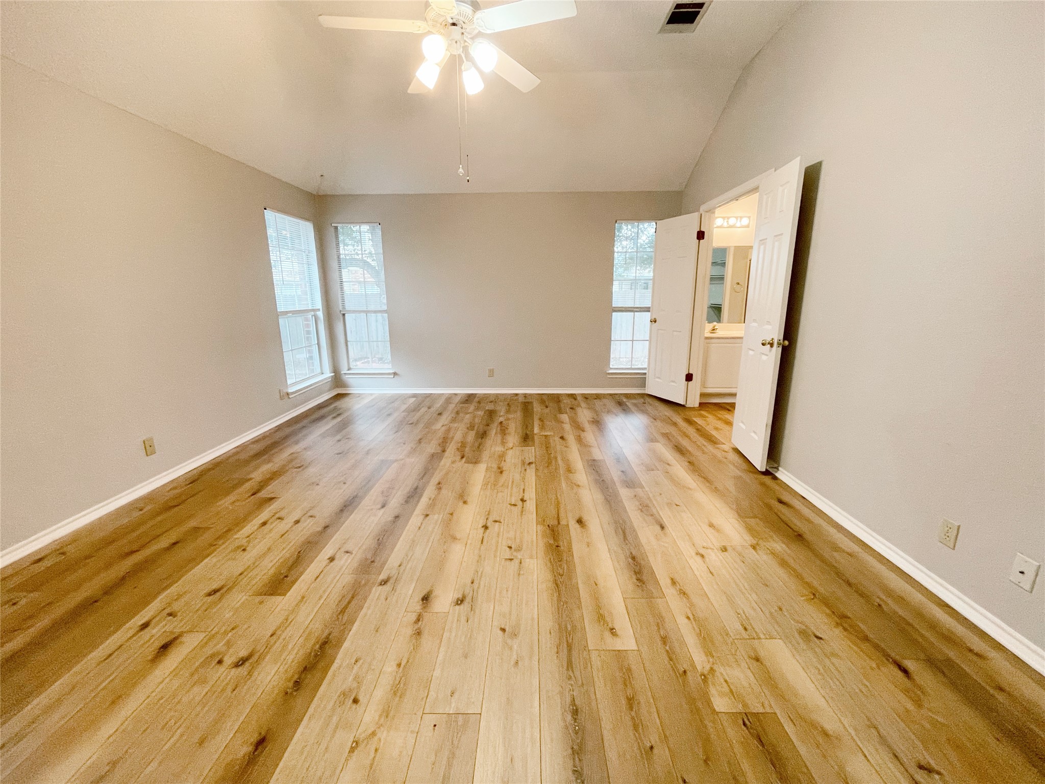 204 Cripple Creek Road Cedar Park, TX 78613 - Photo 17 of 36 The primary bedroom does not disappoint overlooking the backyard.