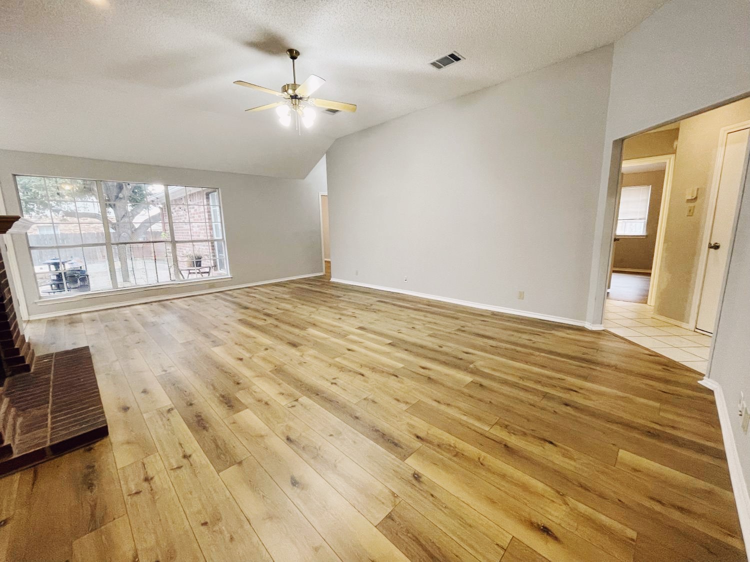 204 Cripple Creek Road Cedar Park, TX 78613 - Photo 10 of 36 The large living room has luxury vinyl planks & large windows for natural light.