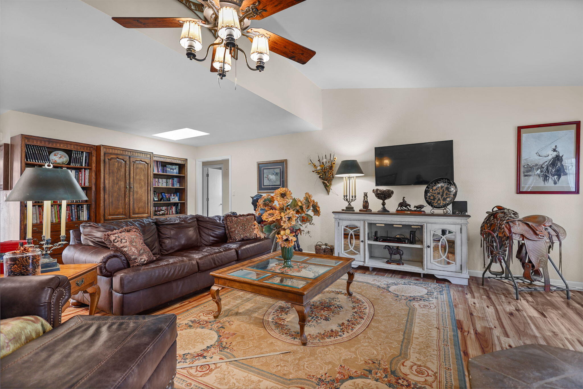 17618 Flowers Lane Anderson, CA 96007 - Photo 5 of 37 a living room with furniture a flat screen tv and a chandelier