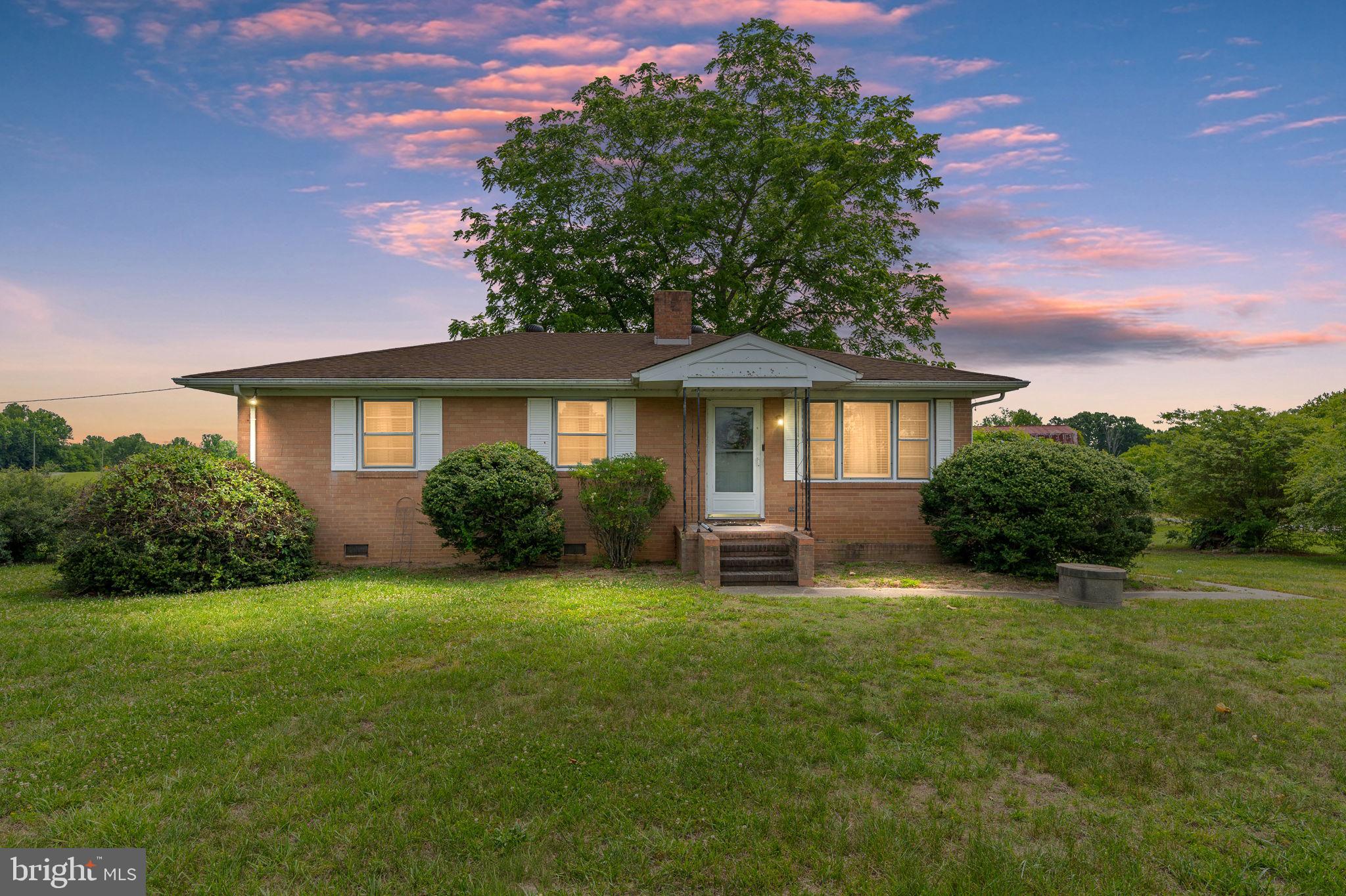 1440 Holly Farm Road Burkeville, VA 23922 - Photo 5 of 52 Charming home with lush greenery.