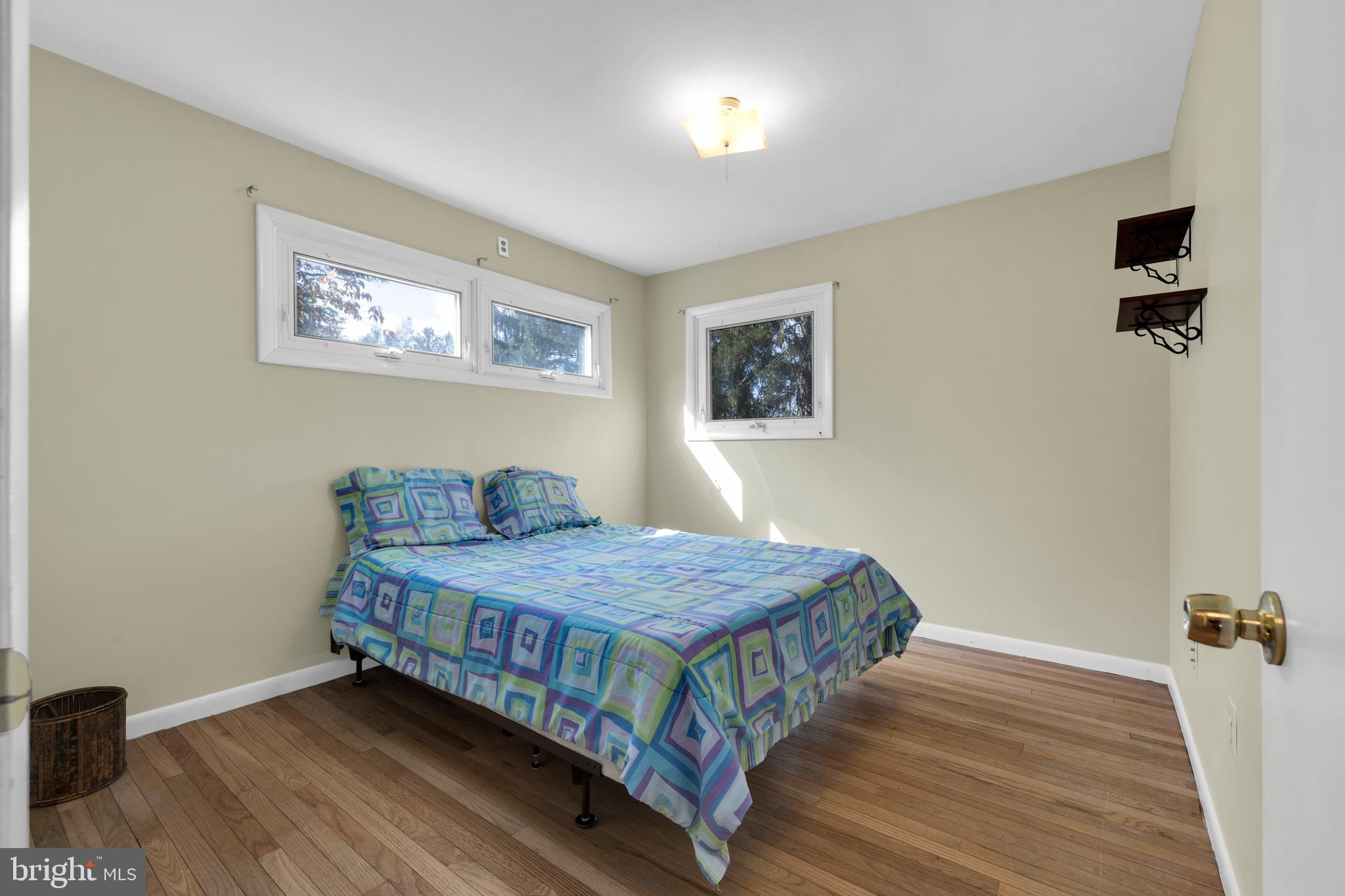 411 North Tulpehocken Road Reading, PA 19601 - Photo 18 of 27 a bedroom with a bed and wooden floor