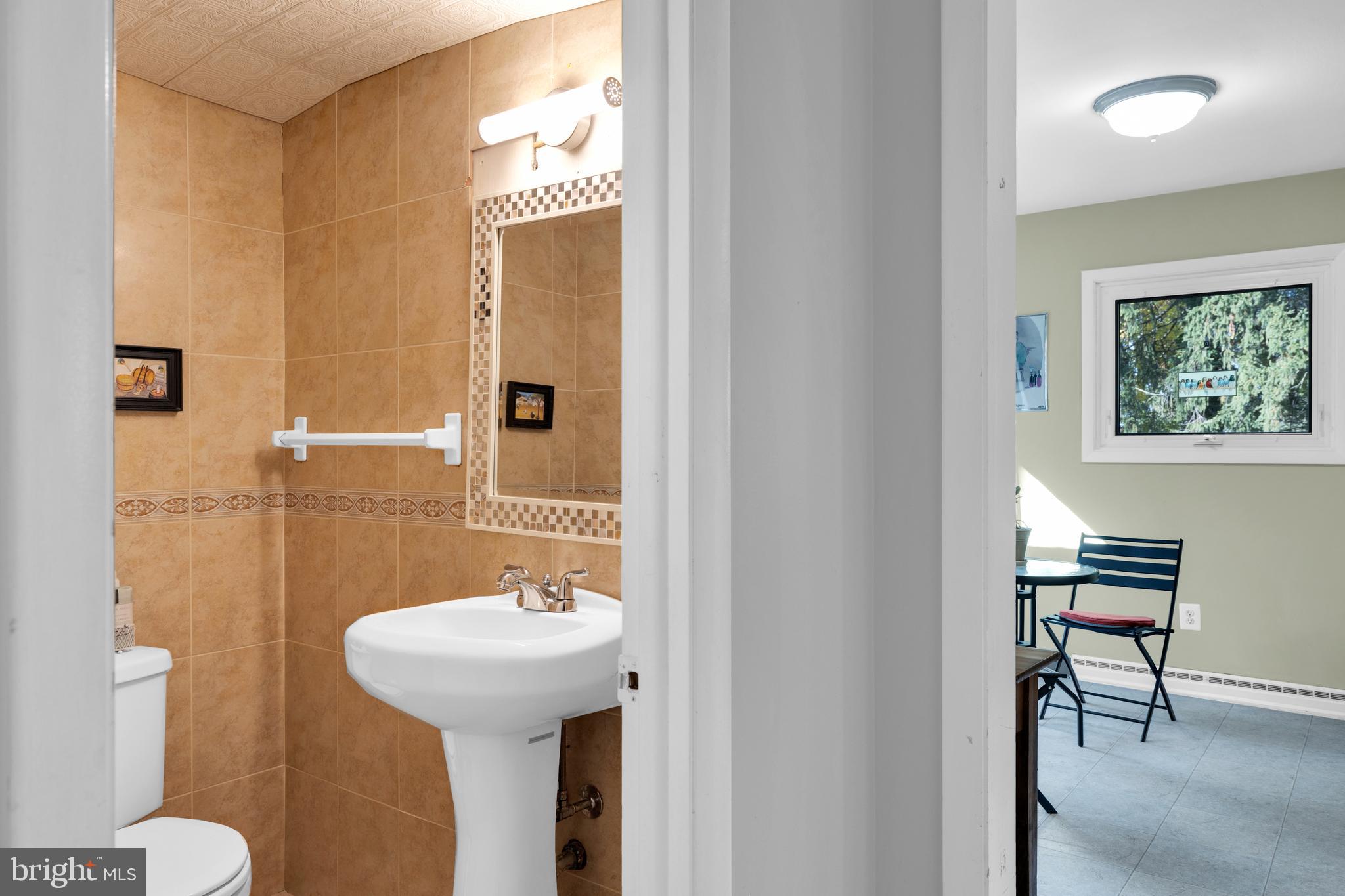 411 North Tulpehocken Road Reading, PA 19601 - Photo 22 of 27 a bathroom with a sink and a mirror