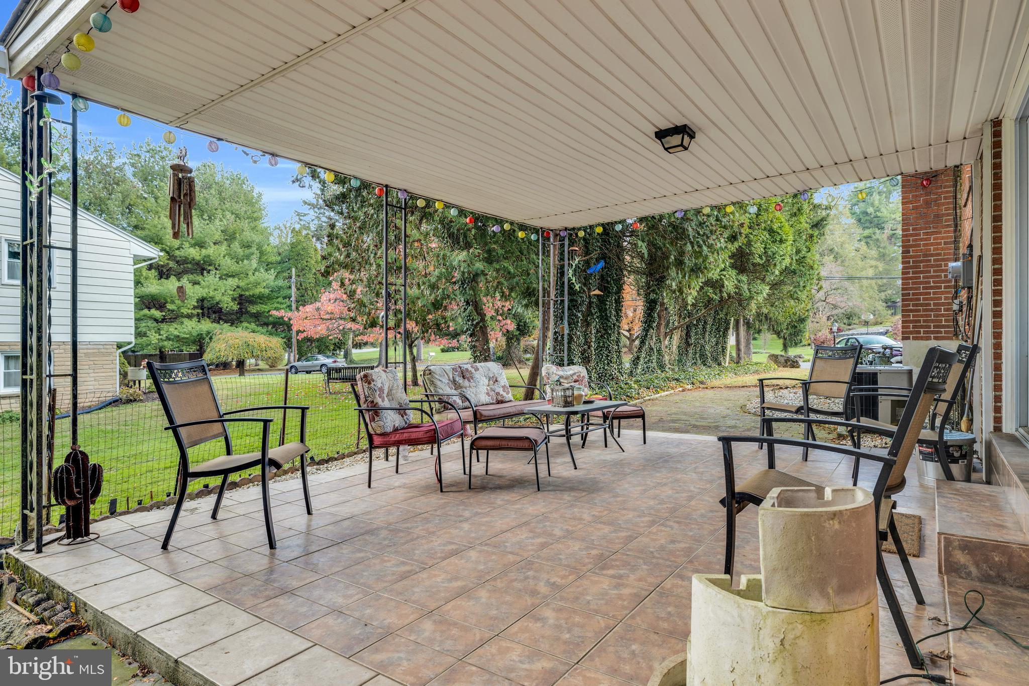 411 North Tulpehocken Road Reading, PA 19601 - Photo 27 of 27 a view of a patio with table and chairs potted plants with large tree