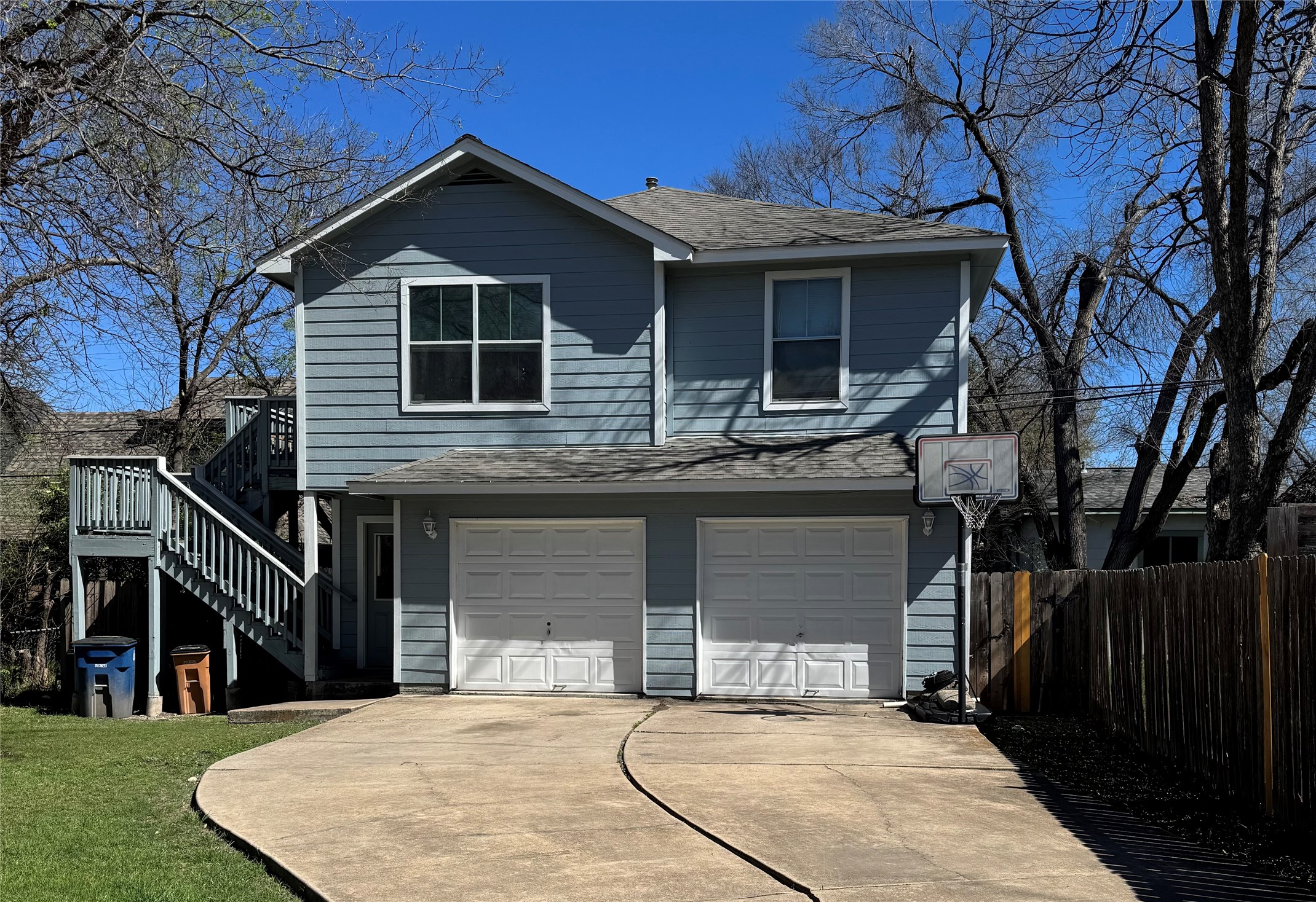106 Franklin Boulevard, Unit B Austin, TX 78751 - Photo 1 of 7 a front view of a house with a yard