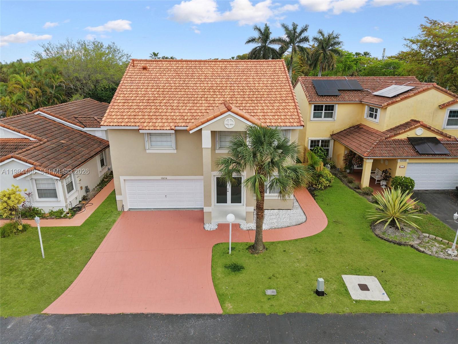 15174 Southwest 111th Street Miami, FL 33196 - Photo 1 of 49 an aerial view of a house