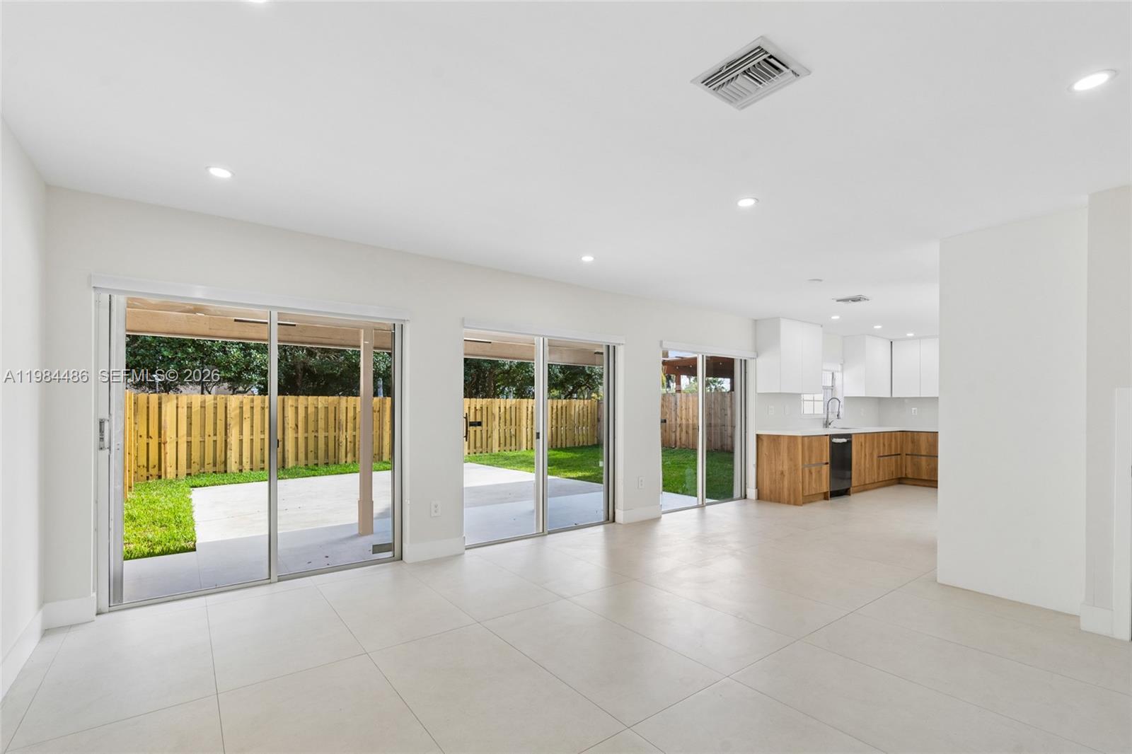 15174 Southwest 111th Street Miami, FL 33196 - Photo 15 of 49 a view of an empty room with windows