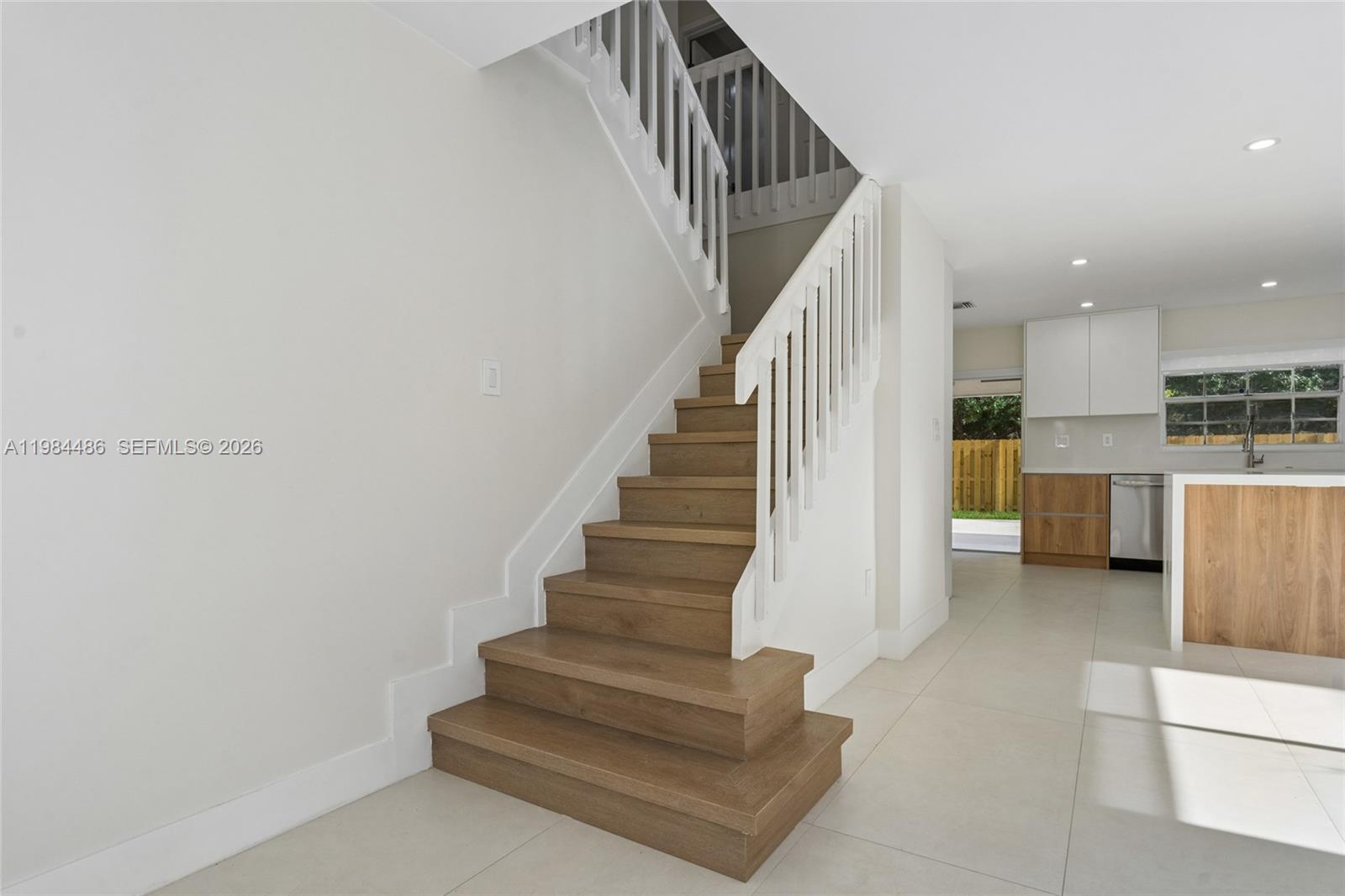 15174 Southwest 111th Street Miami, FL 33196 - Photo 17 of 49 a view of entryway and kitchen