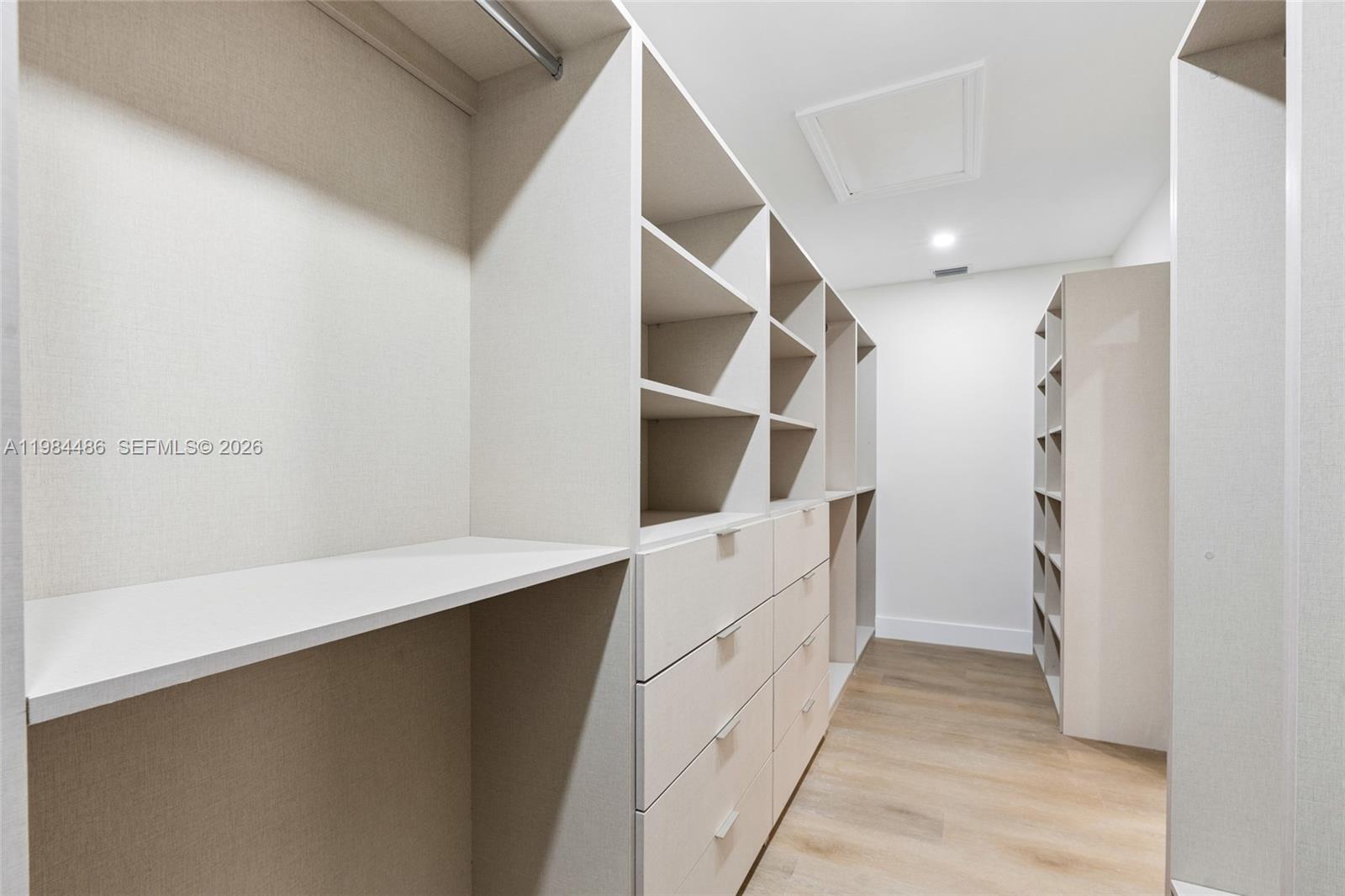 15174 Southwest 111th Street Miami, FL 33196 - Photo 25 of 49 a hallway with cabinets