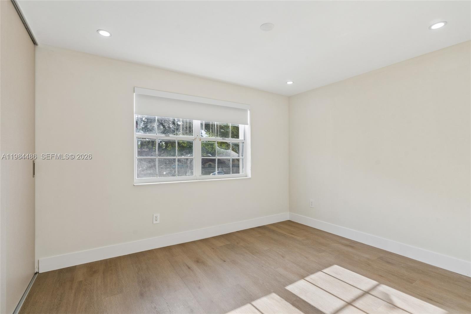 15174 Southwest 111th Street Miami, FL 33196 - Photo 26 of 49 an empty room with a window